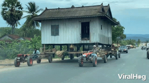 moving-a-house-using-a-tractors-viralhog.gif